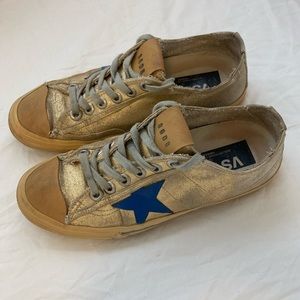Golden Goose Deluxe gold and blue sneakers